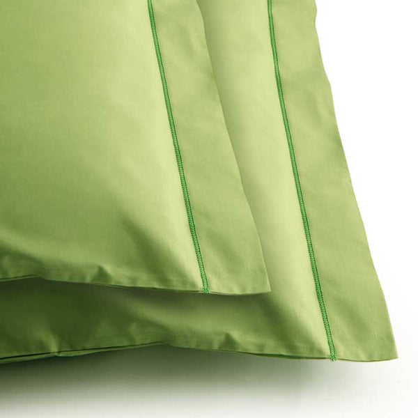 Two cushions in certified organic cotton leaf color