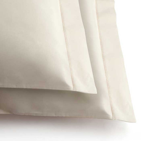 Two certified organic cotton cushions in natural raw colour